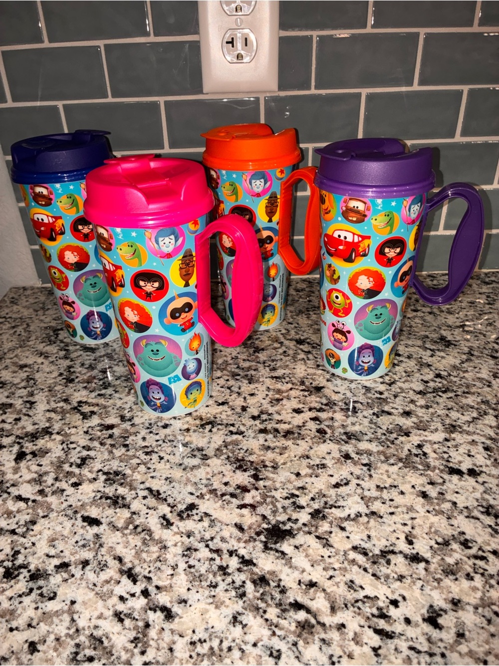 All 4 Disney Cups.
Purple, orange, pink, and blue